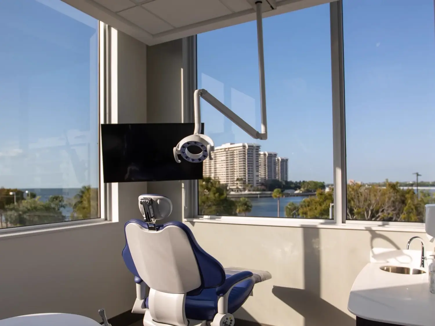 A treatment room at Vizcaya Dental Arts, with windows over Biscayne Bay