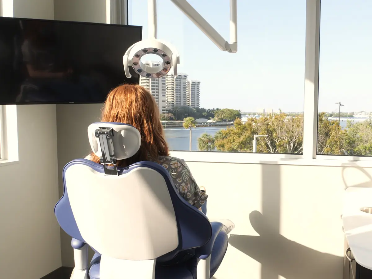A patient in the treatment chair, looking out over Biscayne Bay