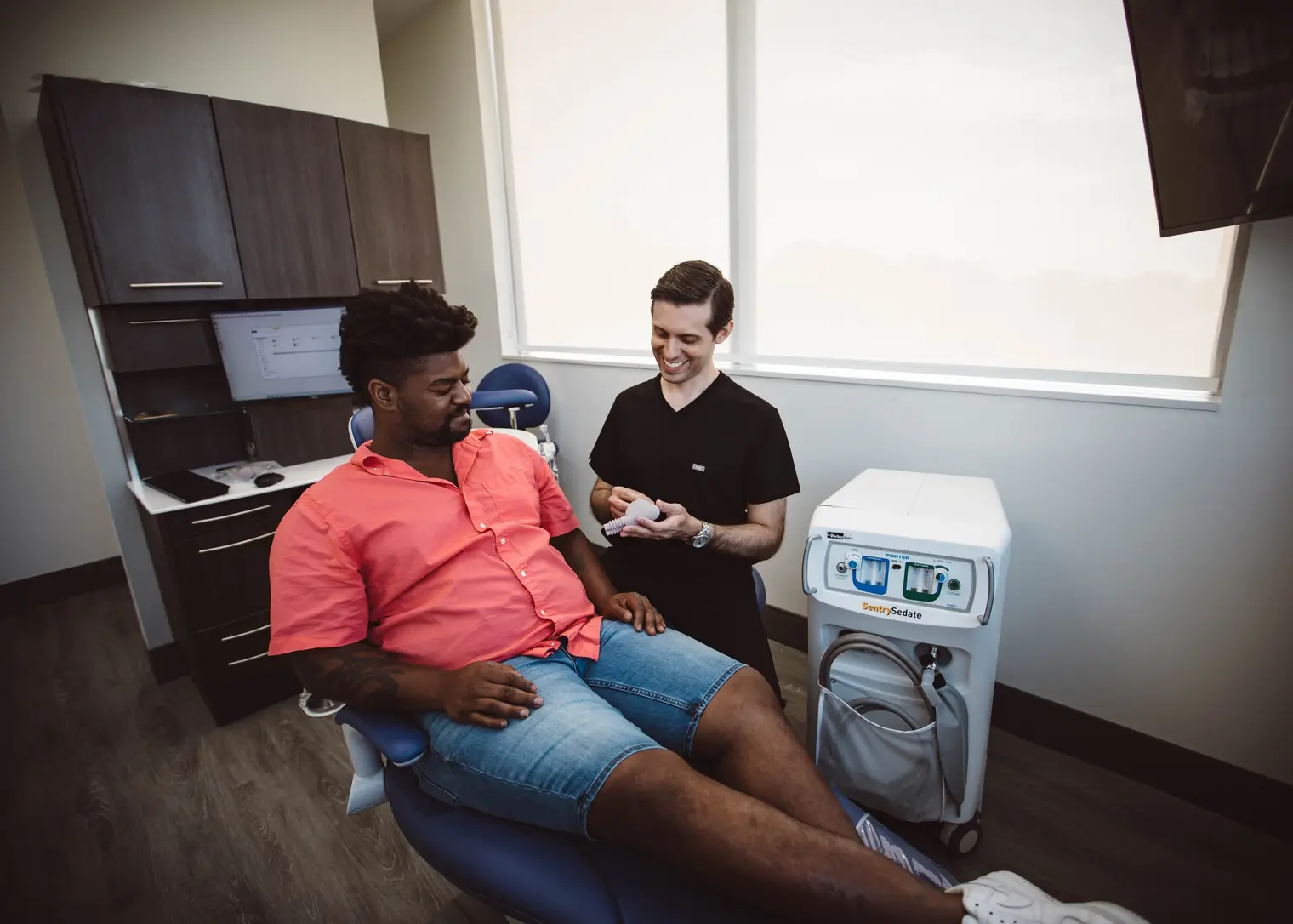 Dr. Kottar talking a patient through what will happen in the treatment room