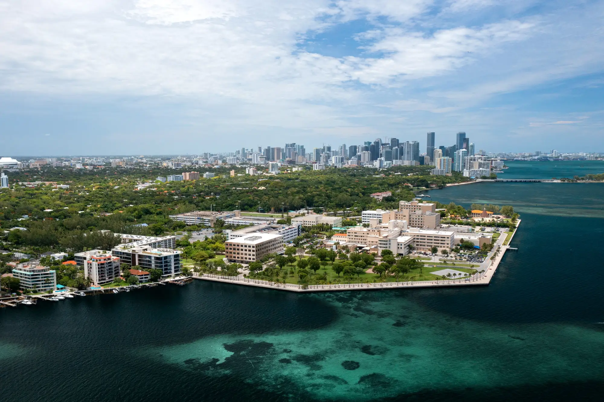 Aerial view of the Mercy Hospital campus on Biscayne Bay, with the office marked, Brickell behind it, Coconut Grove to the left and Key Biscayne to the right